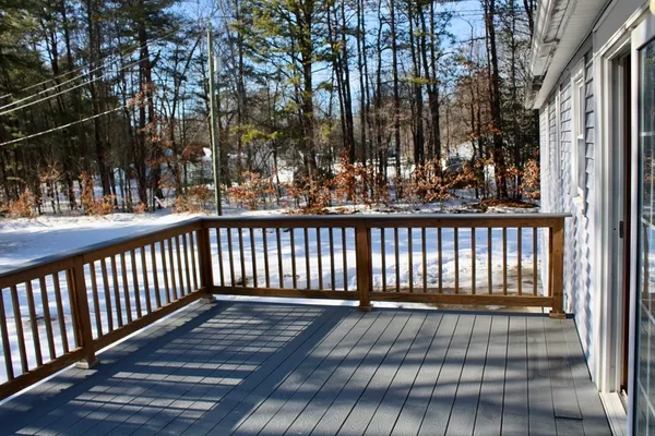 a view of balcony with wooden floor