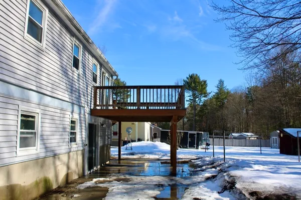 a backyard of a house with outdoor seating