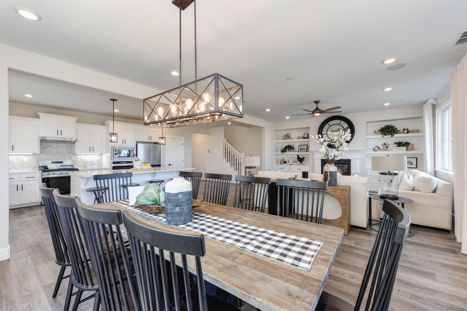 4080 Peter's Court Rocklin, CA 95765 - Photo 15 of 64 a view of a dining room and livingroom with furniture wooden floor a chandelier
