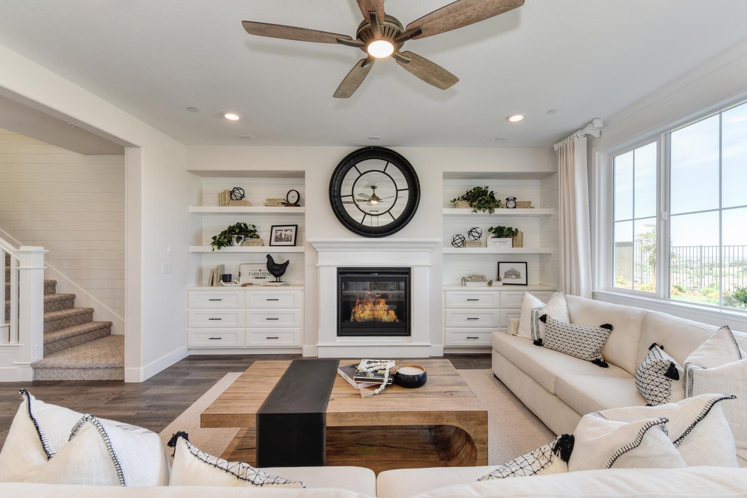 4080 Peter's Court Rocklin, CA 95765 - Photo 16 of 64 a living room with furniture a fireplace and a large window