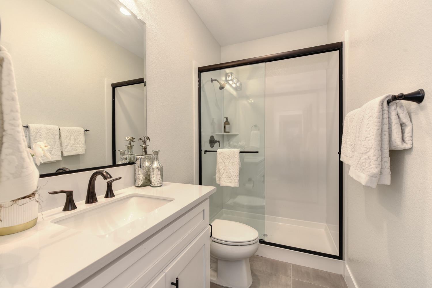 4080 Peter's Court Rocklin, CA 95765 - Photo 28 of 64 a bathroom with a sink a toilet and shower