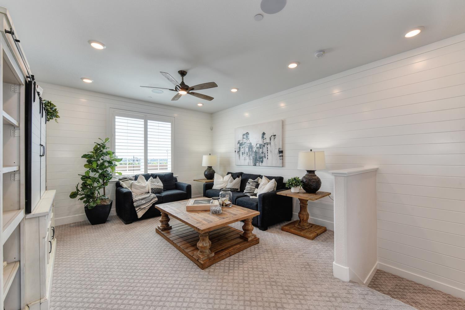 4080 Peter's Court Rocklin, CA 95765 - Photo 36 of 64 a living room with furniture and a chandelier