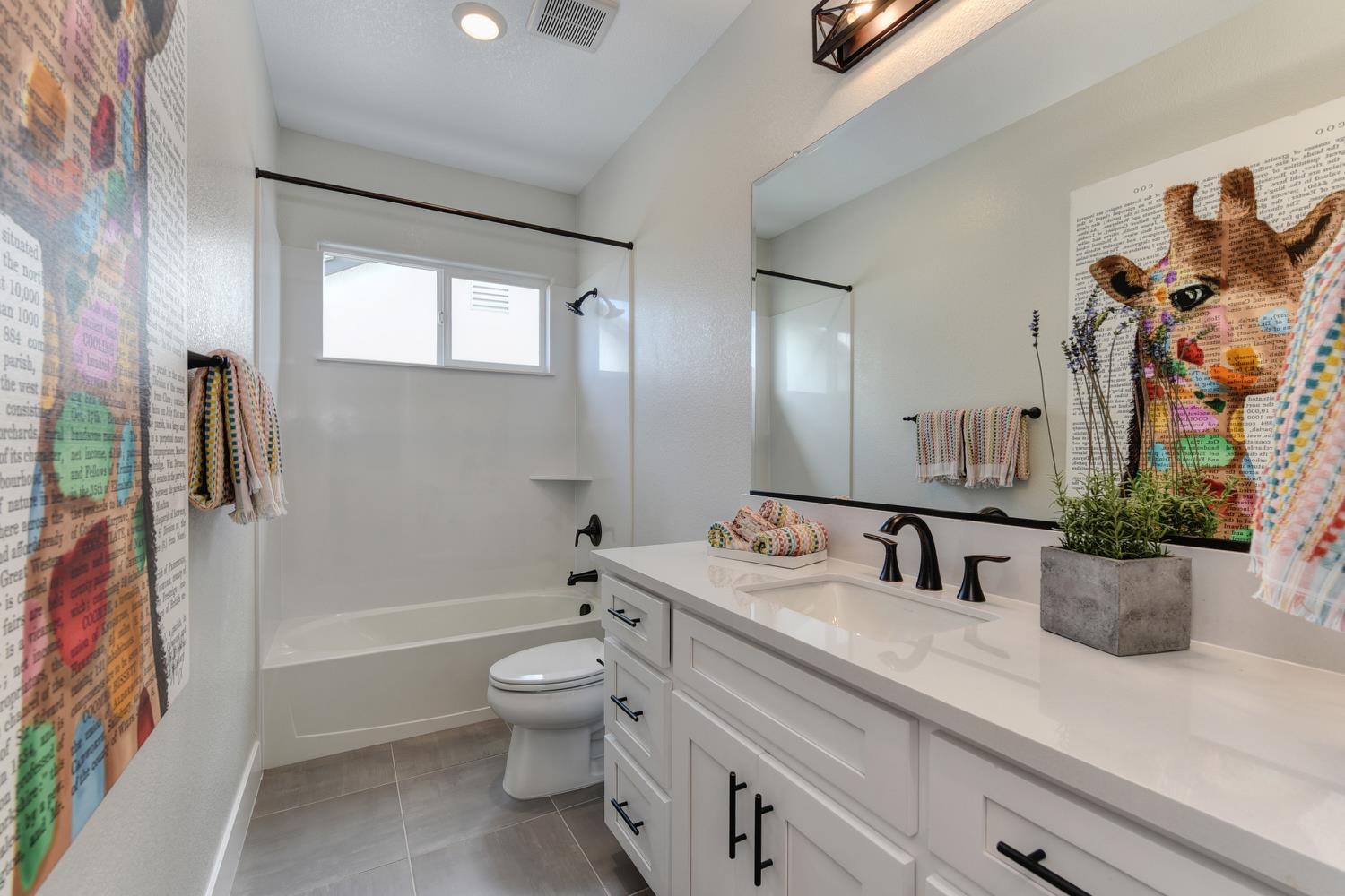 4080 Peter's Court Rocklin, CA 95765 - Photo 41 of 64 a bathroom with a sink a toilet and shower