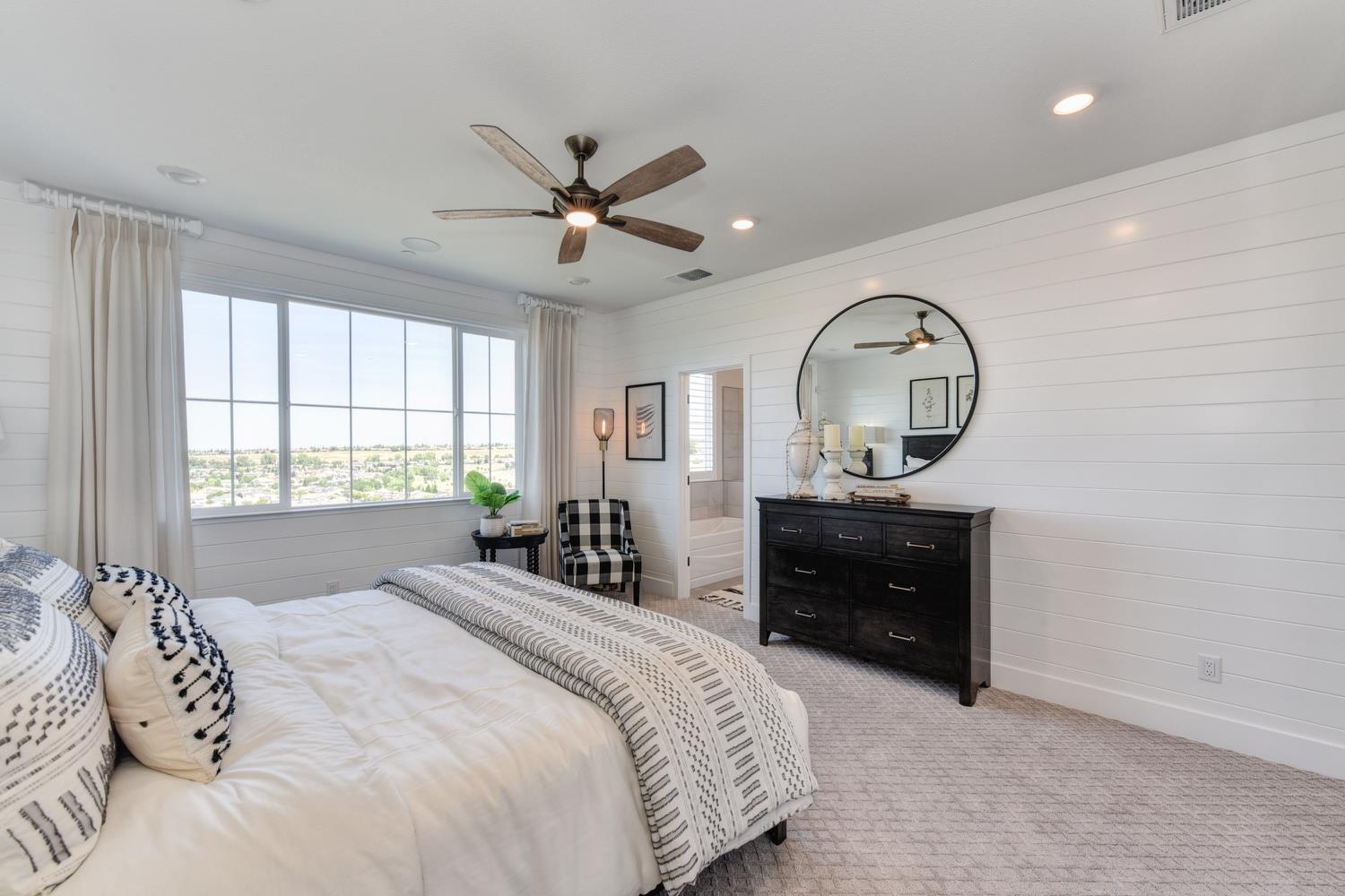 4080 Peter's Court Rocklin, CA 95765 - Photo 45 of 64 a bedroom with a large bed and a window