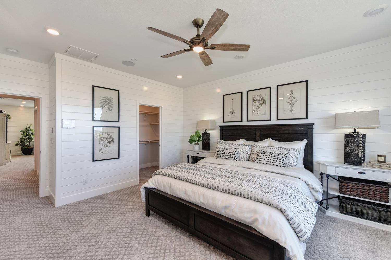 4080 Peter's Court Rocklin, CA 95765 - Photo 47 of 64 a bedroom with a large bed and a chandelier