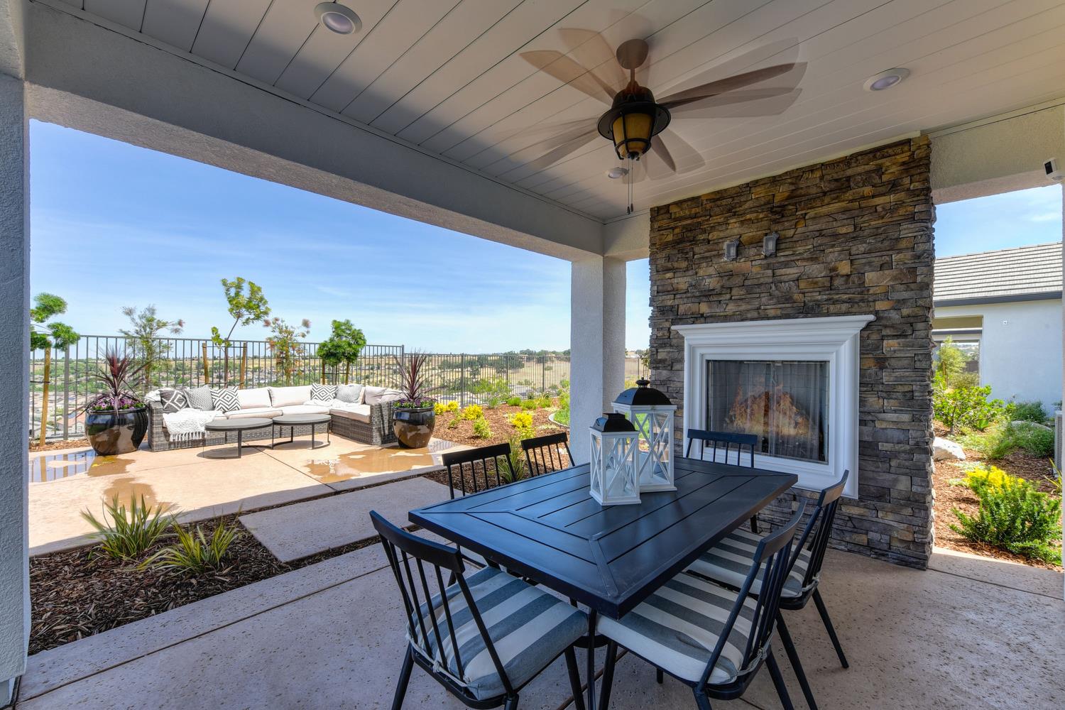4080 Peter's Court Rocklin, CA 95765 - Photo 55 of 64 a dining room with furniture and a fireplace