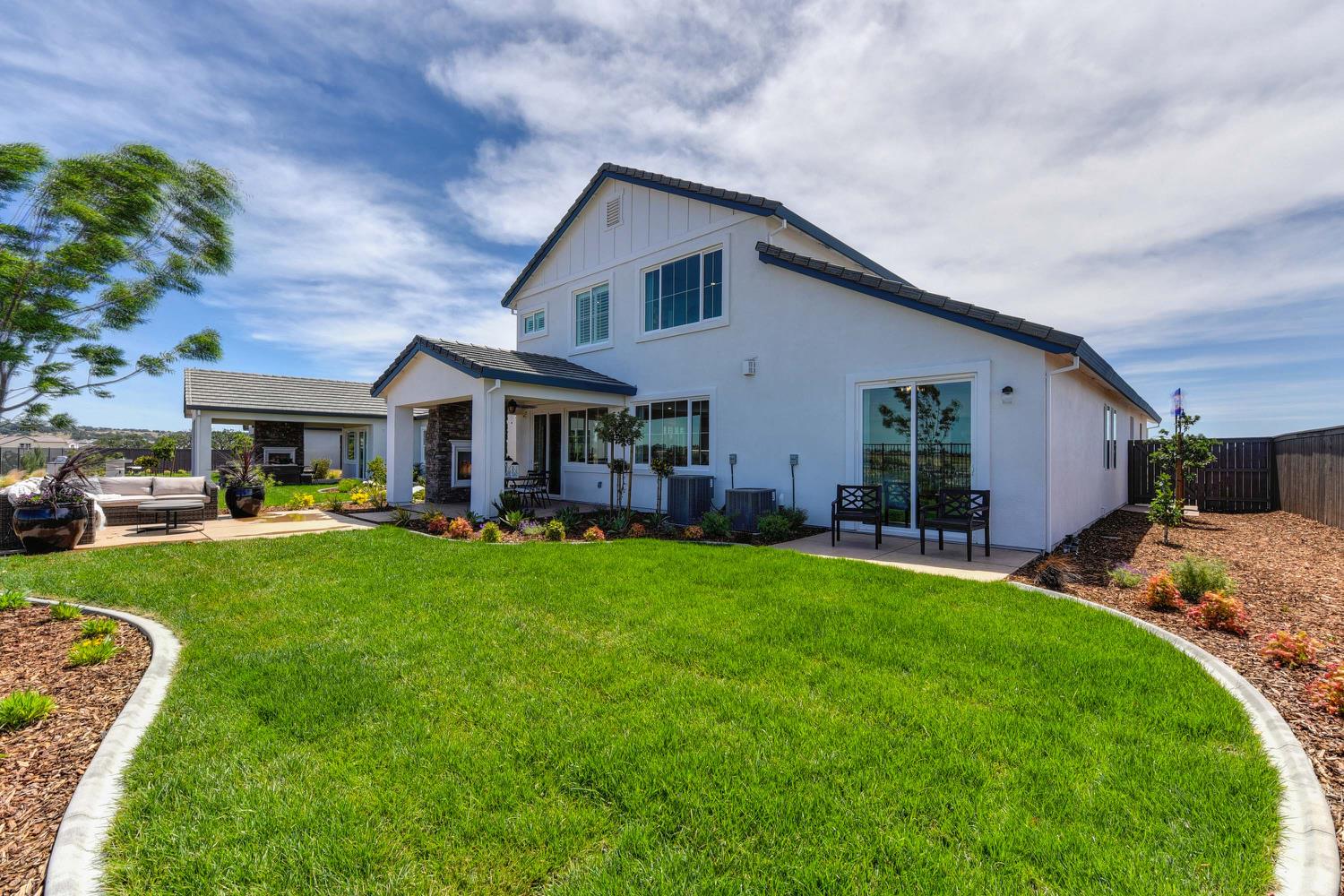 4080 Peter's Court Rocklin, CA 95765 - Photo 59 of 64 a front view of a house with garden and porch