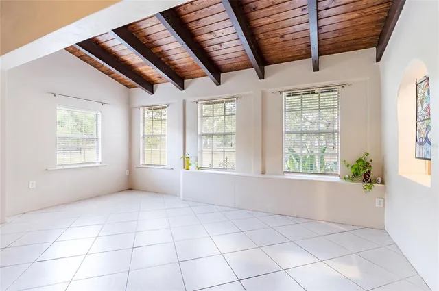 a living room with furniture and a ceiling fan