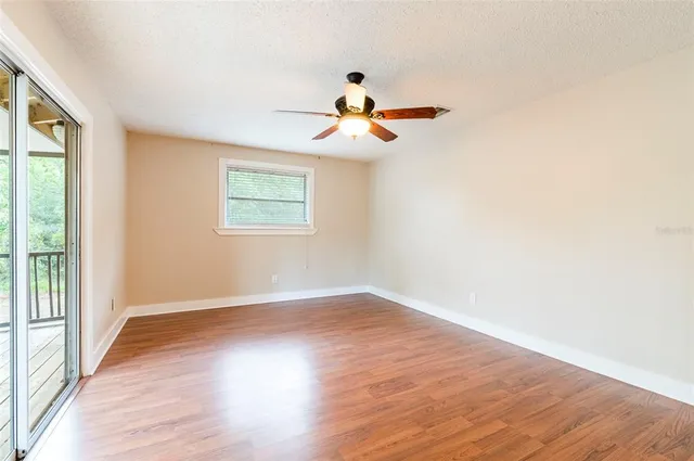 a view of a house with a tree and yard