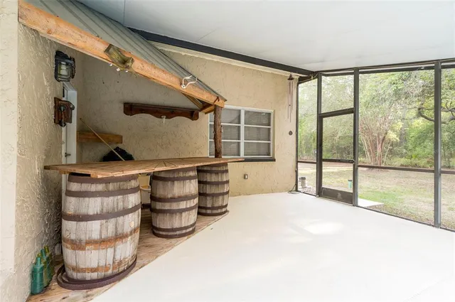 a view of a swimming pool with an outdoor space and seating area