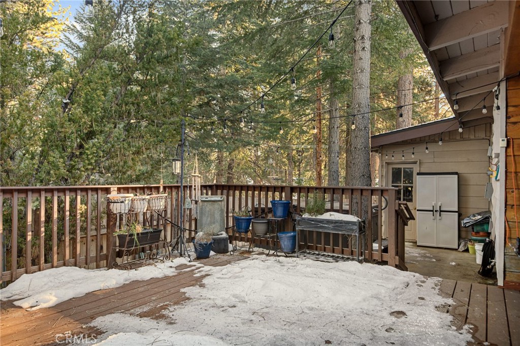 31466 Frontier Drive Running Springs, CA 92382 - Photo 18 of 43 a view of backyard with barbeque grill and wooden fence