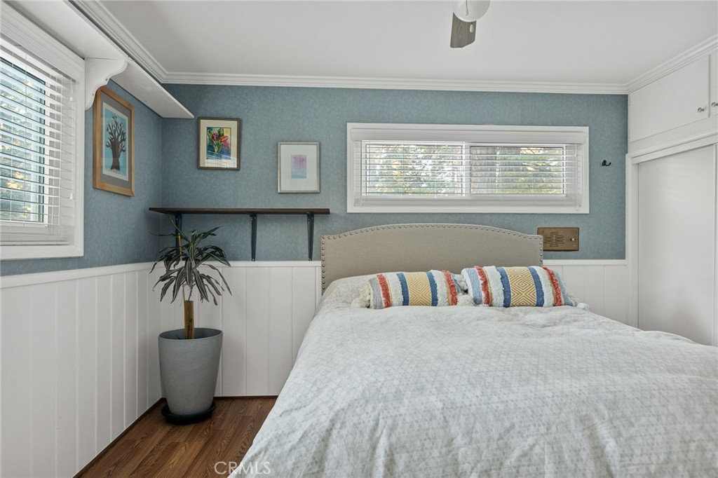 31466 Frontier Drive Running Springs, CA 92382 - Photo 24 of 43 a bedroom with a bed and wooden floor