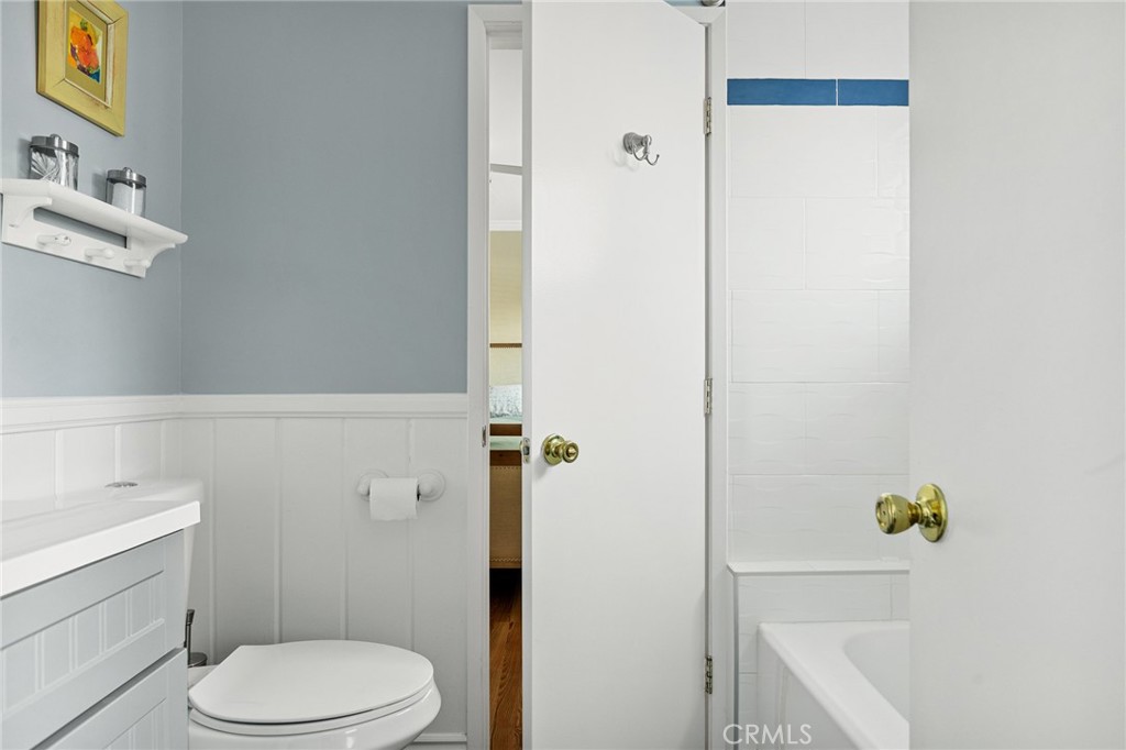 31466 Frontier Drive Running Springs, CA 92382 - Photo 26 of 43 a white toilet sitting next to a bathroom sink