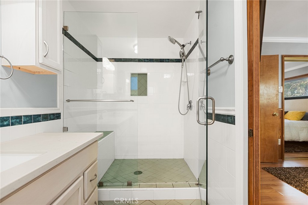 31466 Frontier Drive Running Springs, CA 92382 - Photo 31 of 43 a bathroom with a sink and shower