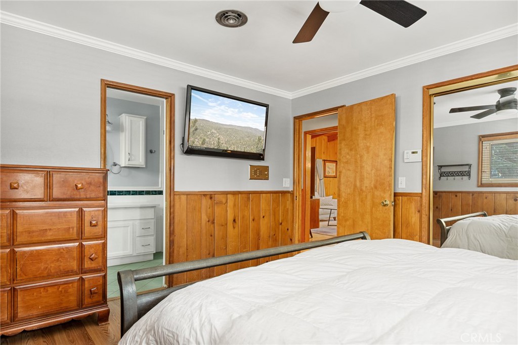 31466 Frontier Drive Running Springs, CA 92382 - Photo 33 of 43 a bedroom with a bed and cabinets