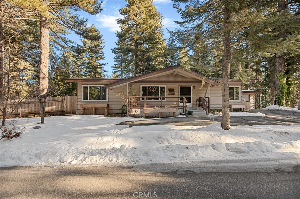 31466 Frontier Drive Running Springs, CA 92382 - Photo 4 of 43 a white house with tree in front of it