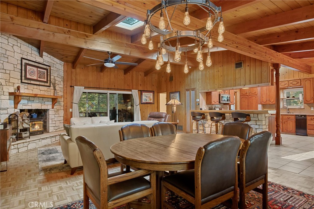31466 Frontier Drive Running Springs, CA 92382 - Photo 7 of 43 a view of a dining room with furniture window and outside view