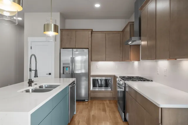 a kitchen with a sink and refrigerator