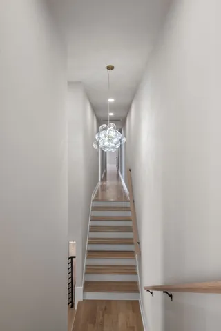 a view of a hallway with seating space