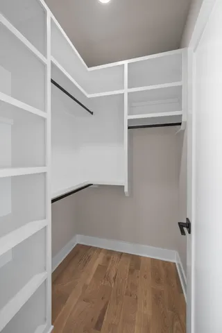 a view of an empty walk in closet