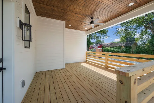 a view of a room with wooden floor