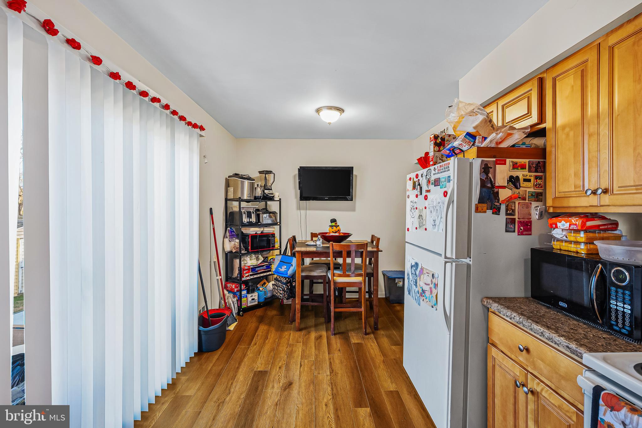 144 New Cedar Lane Hamilton, NJ 08610 - Photo 25 of 48 a view of a kitchen with fridge and workspace