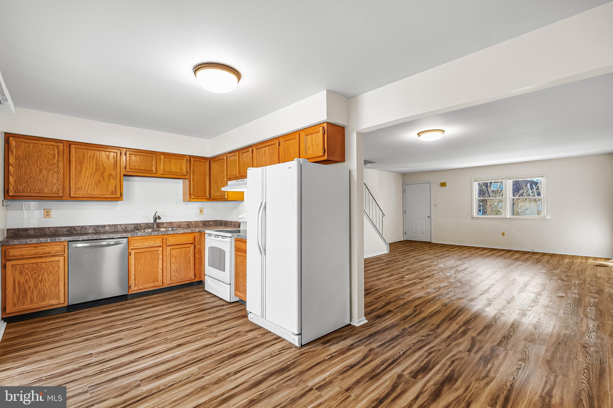 144 New Cedar Lane Hamilton, NJ 08610 - Photo 26 of 48 a kitchen with a refrigerator and a stove top oven