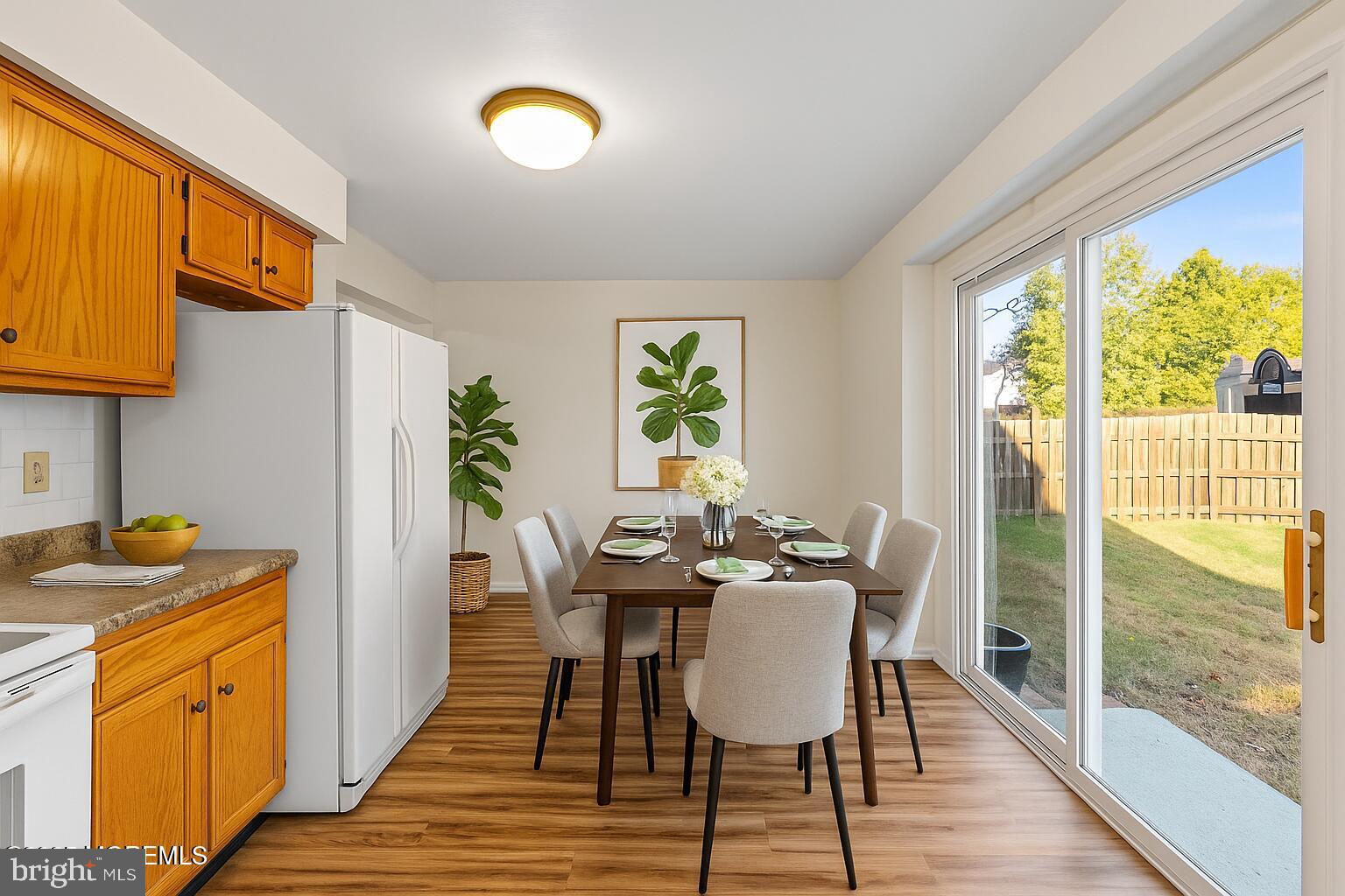 144 New Cedar Lane Hamilton, NJ 08610 - Photo 28 of 48 a view of a dining room with furniture window and wooden floor