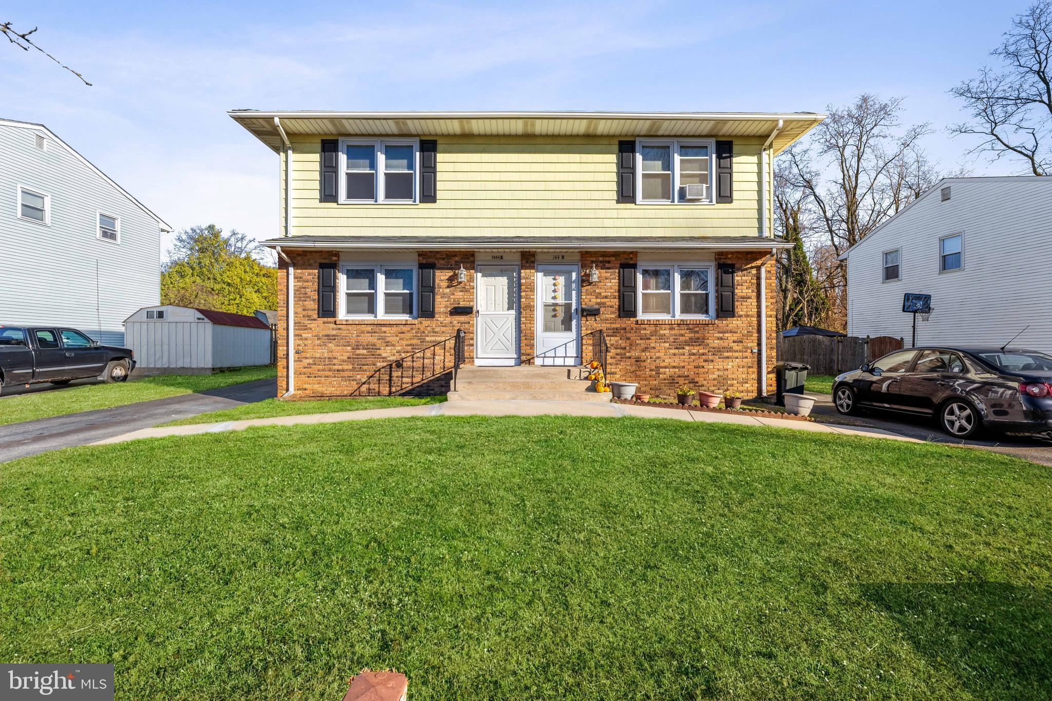 144 New Cedar Lane Hamilton, NJ 08610 - Photo 3 of 48 a front view of a house with garden