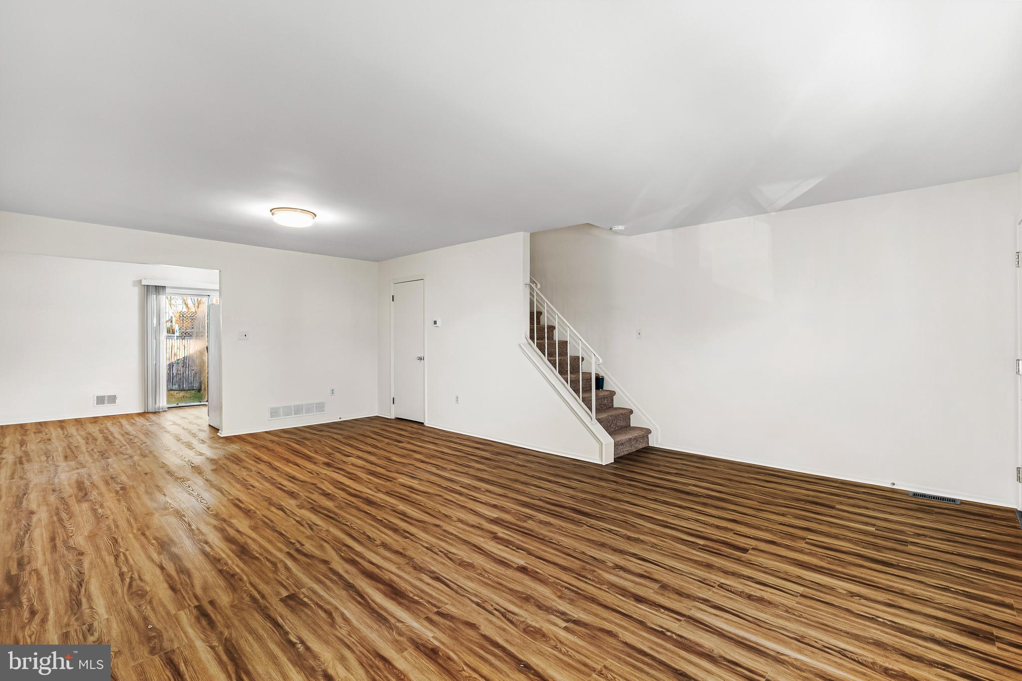 144 New Cedar Lane Hamilton, NJ 08610 - Photo 32 of 48 a view of an empty room with wooden floor