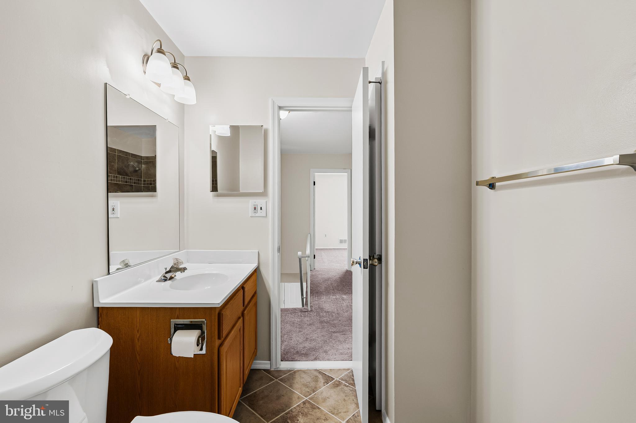 144 New Cedar Lane Hamilton, NJ 08610 - Photo 43 of 48 a bathroom with a sink a toilet and shower