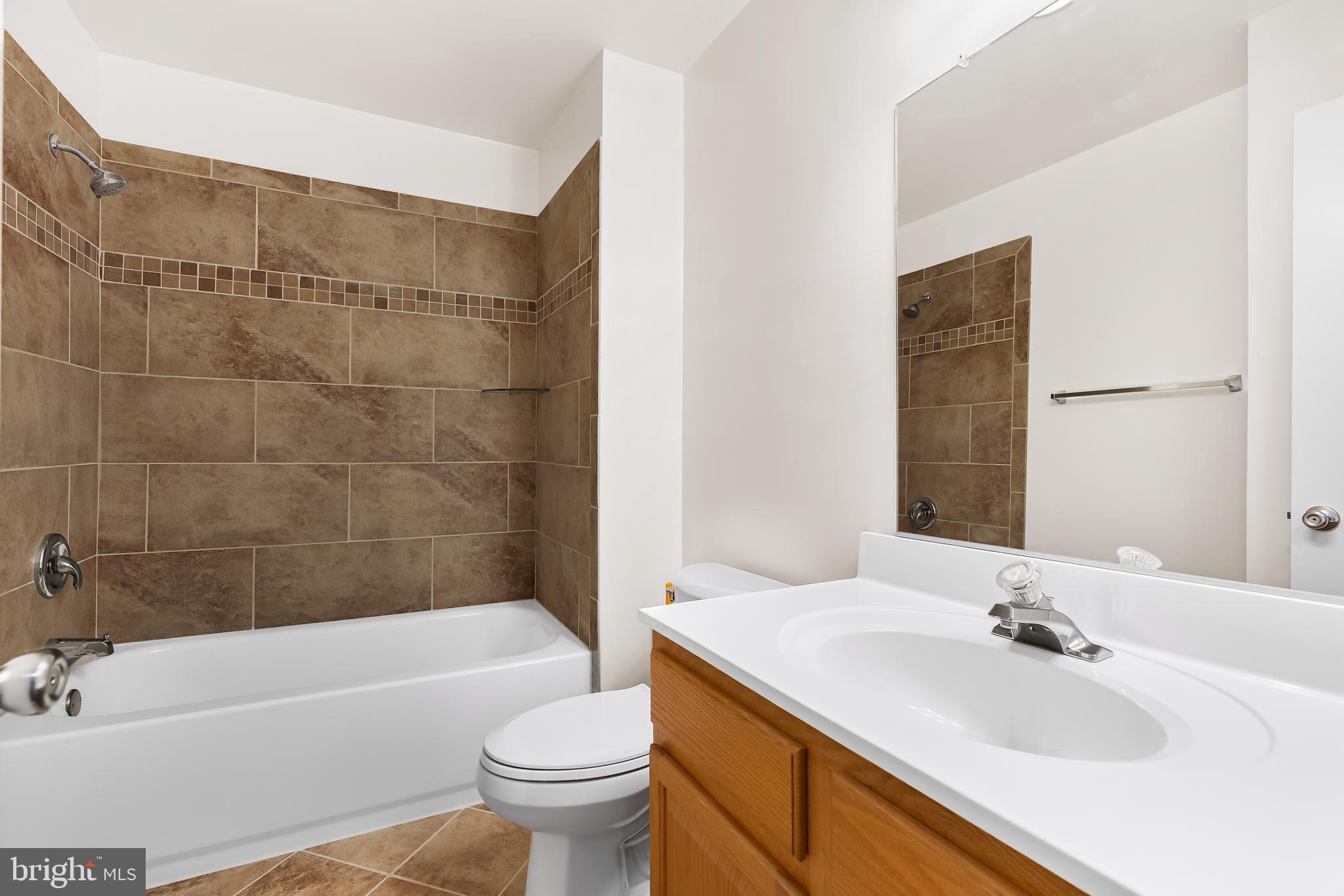 144 New Cedar Lane Hamilton, NJ 08610 - Photo 44 of 48 a bathroom with a sink a toilet and a bathtub