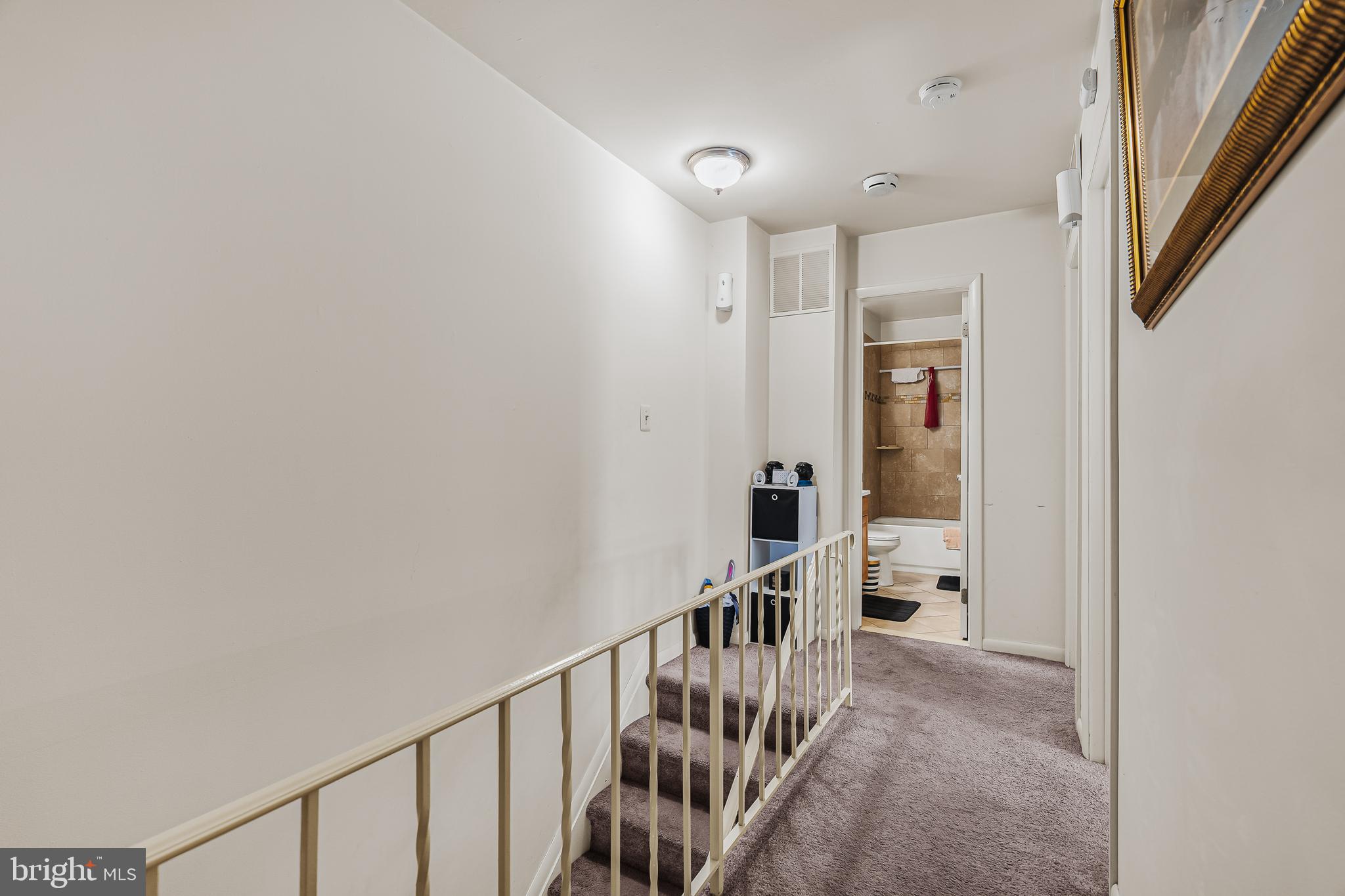 144 New Cedar Lane Hamilton, NJ 08610 - Photo 6 of 48 a view of a hallway with wooden floor and windows