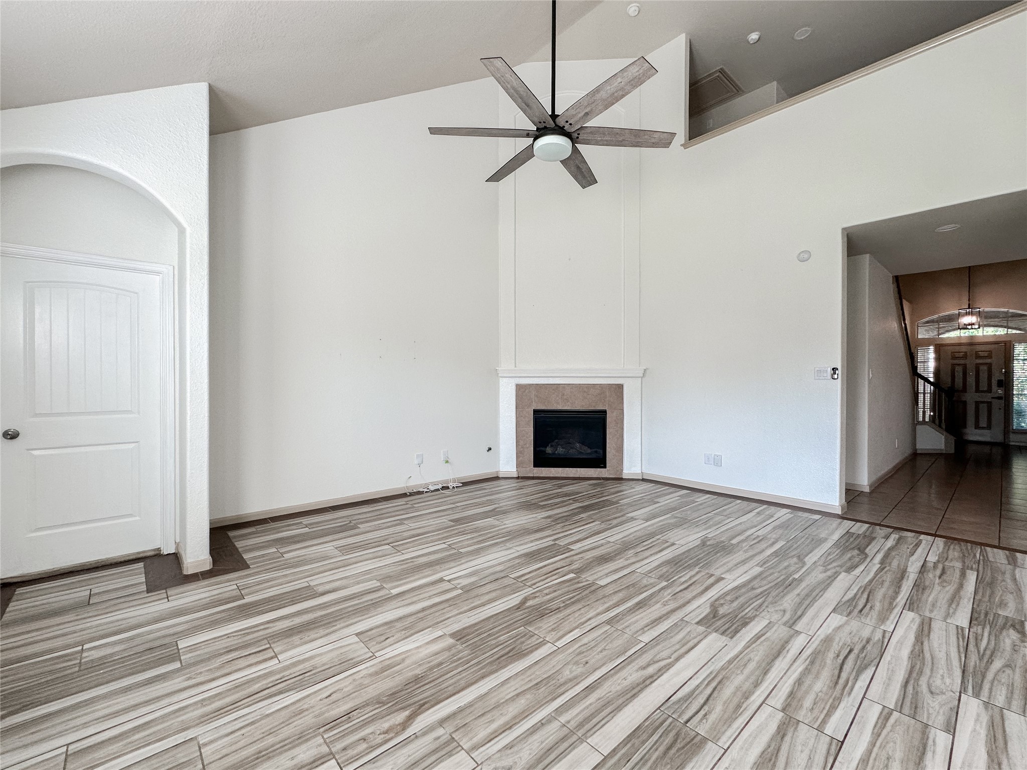 20319 Little Wing Drive Spring, TX 77388 - Photo 45 of 49 a view of an empty room with wooden floor fireplace and a window
