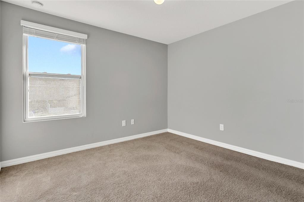 1621 Reflection Cove St. Cloud, FL 34771 - Photo 17 of 35 an empty room with a window