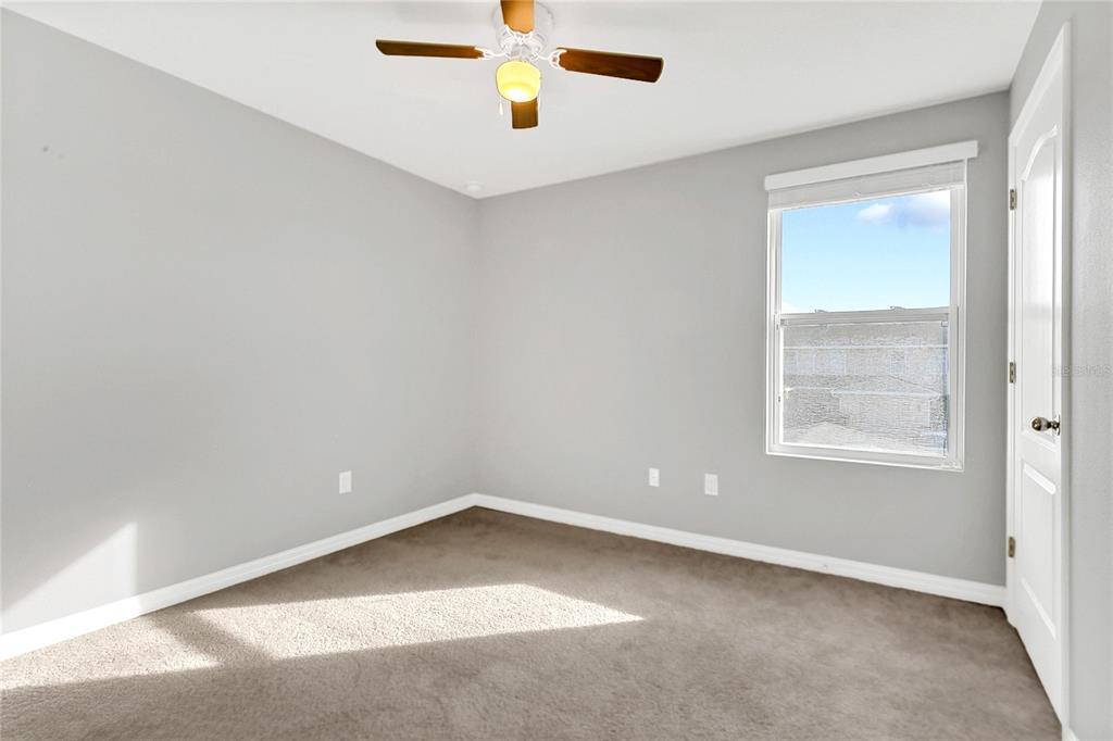 1621 Reflection Cove St. Cloud, FL 34771 - Photo 18 of 35 an empty room with a window