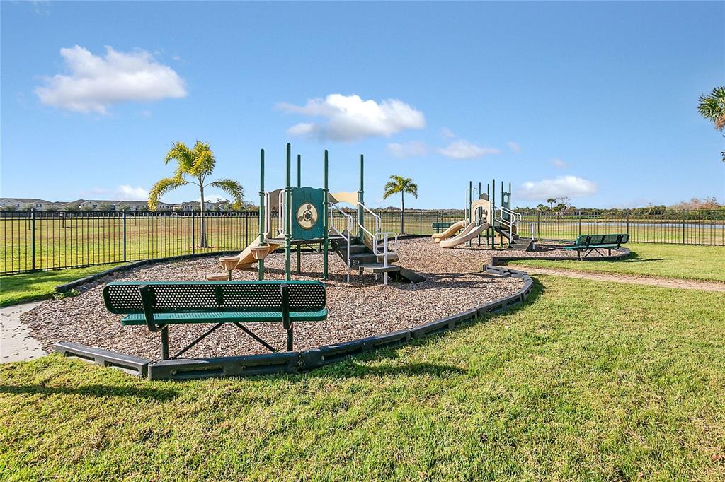 1621 Reflection Cove St. Cloud, FL 34771 - Photo 24 of 35 a view of a swimming pool with a patio
