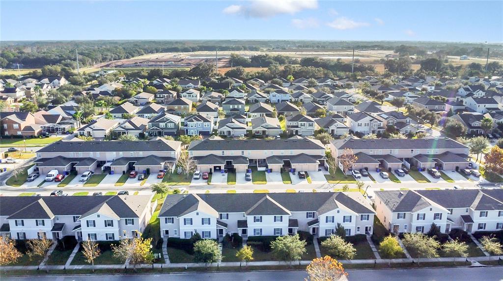 1621 Reflection Cove St. Cloud, FL 34771 - Photo 27 of 35 an aerial view of residential houses with outdoor space