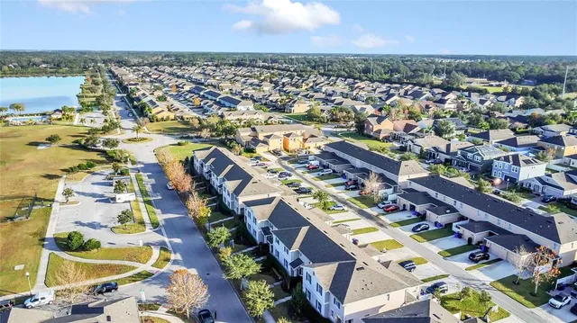 an aerial view of residential houses with outdoor space