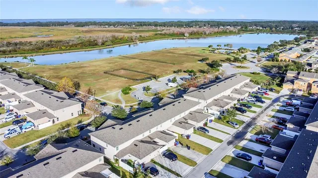 an aerial view of residential houses with outdoor space