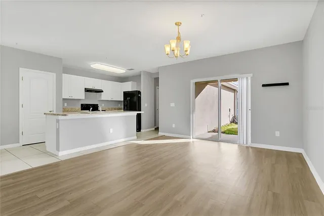 a view of a kitchen with microwave and cabinets