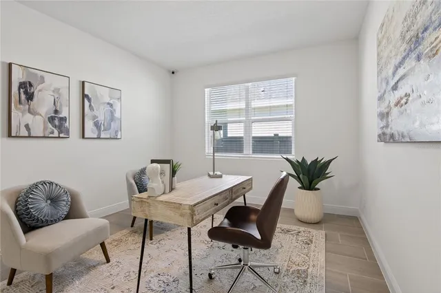 a workspace with furniture and window