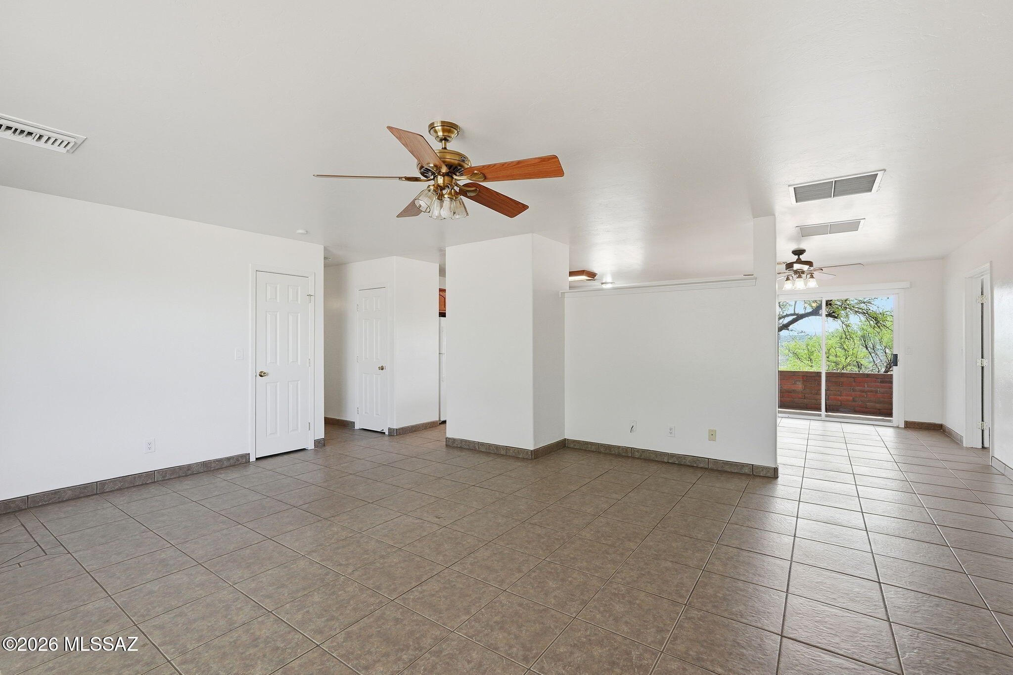 1462 Circulo Sombrero Rio Rico, AZ 85648 - Photo 14 of 50 The Living to Dining wall is lower for your decorating flourish.