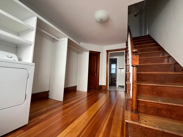 a view of entryway with wooden floor