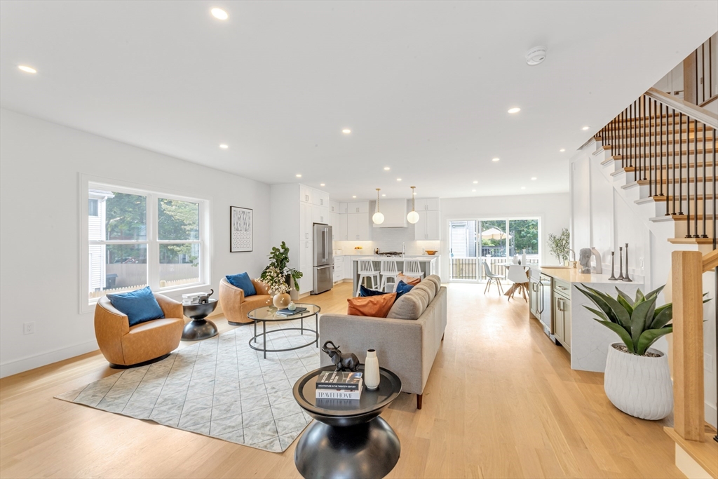 47 Corbett Avenue, Unit 47 Dedham, MA 02026 - Photo 1 of 33 a living room with furniture and a potted plant