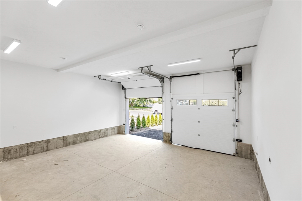 47 Corbett Avenue, Unit 47 Dedham, MA 02026 - Photo 13 of 33 a view of a garage