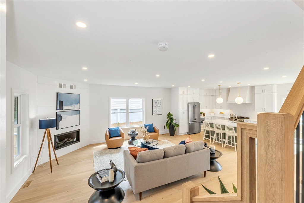 47 Corbett Avenue, Unit 47 Dedham, MA 02026 - Photo 2 of 33 a living room with furniture and a wooden floor