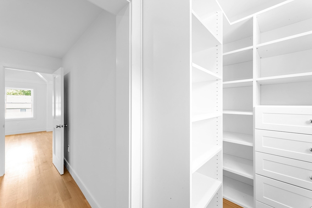 47 Corbett Avenue, Unit 47 Dedham, MA 02026 - Photo 30 of 33 a view of closet area with empty racks