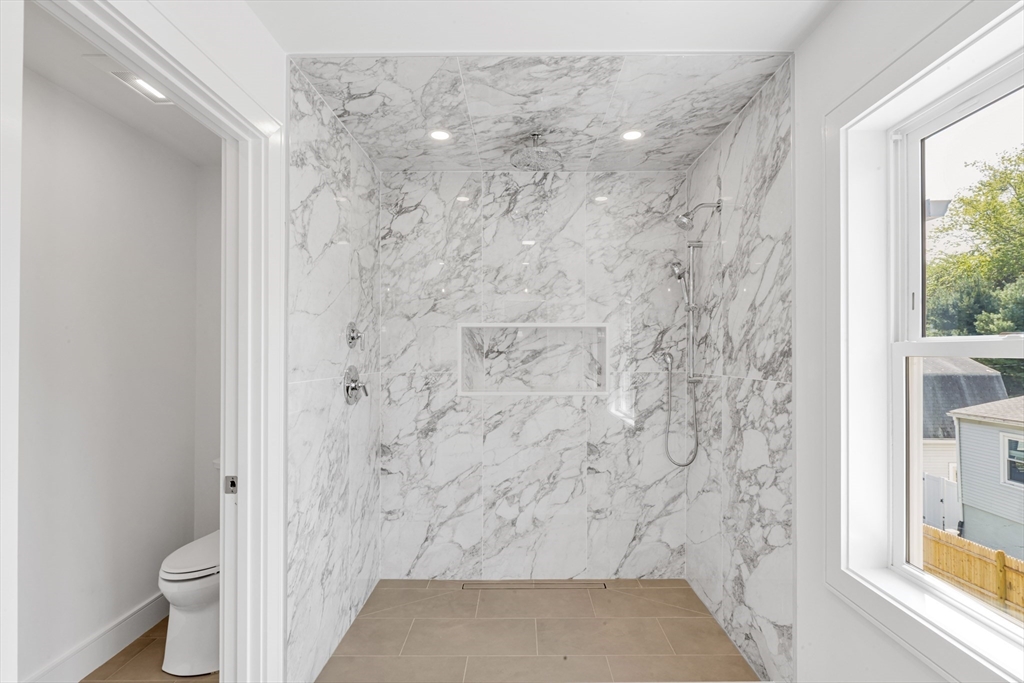 47 Corbett Avenue, Unit 47 Dedham, MA 02026 - Photo 32 of 33 a bathroom with a shower