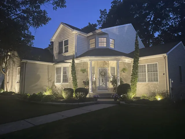 a front view of a house with a yard